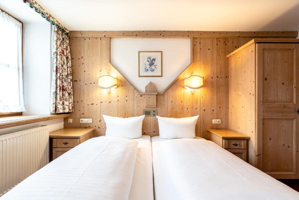 Postel nebo postele na pokoji v ubytování Hotel Hölzer Bräu by Lehmann Hotels
