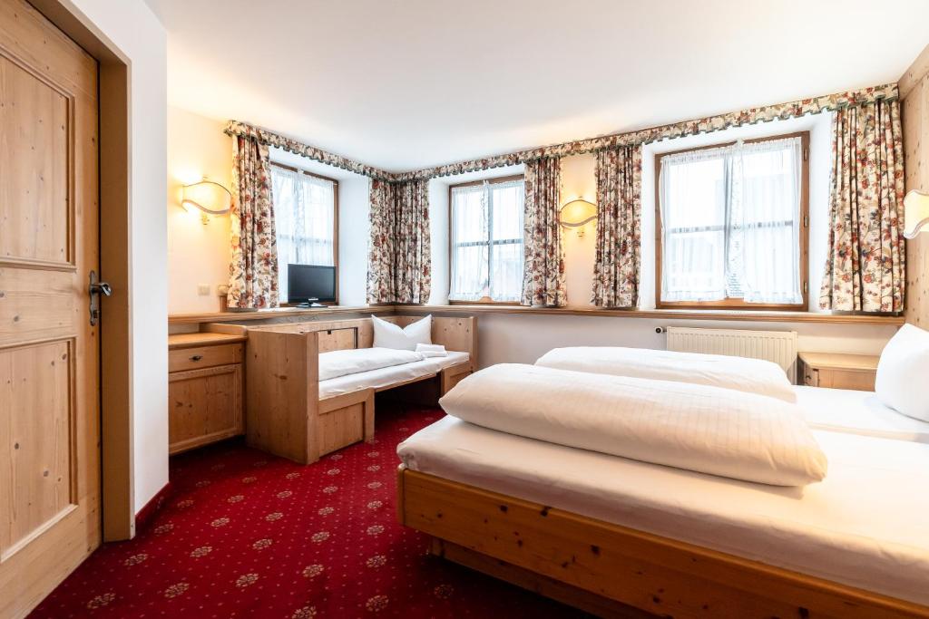 Postel nebo postele na pokoji v ubytování Hotel Hölzer Bräu by Lehmann Hotels