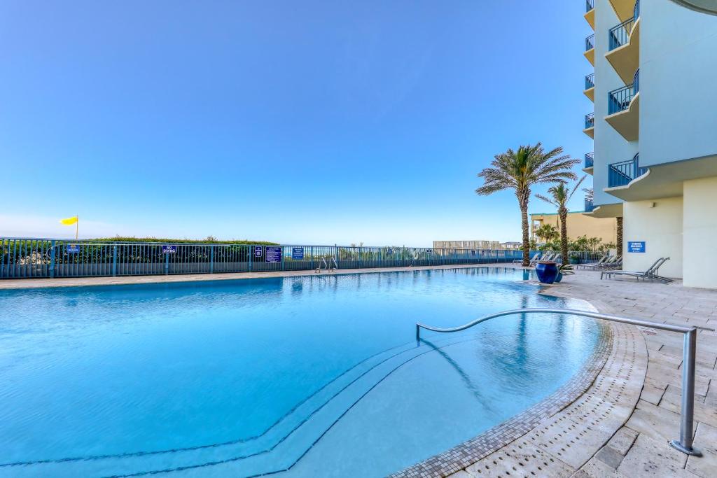 a large swimming pool in front of a building at Sterling Breeze 3 in Panama City Beach