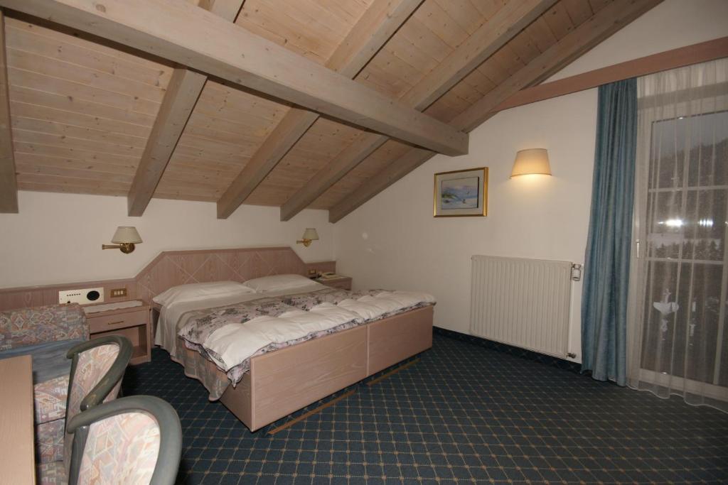 Postel nebo postele na pokoji v ubytování Hotel Villa Mozart