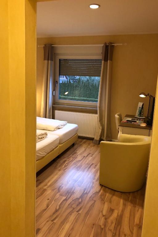 Postel nebo postele na pokoji v ubytování Landhotel Franck Garni