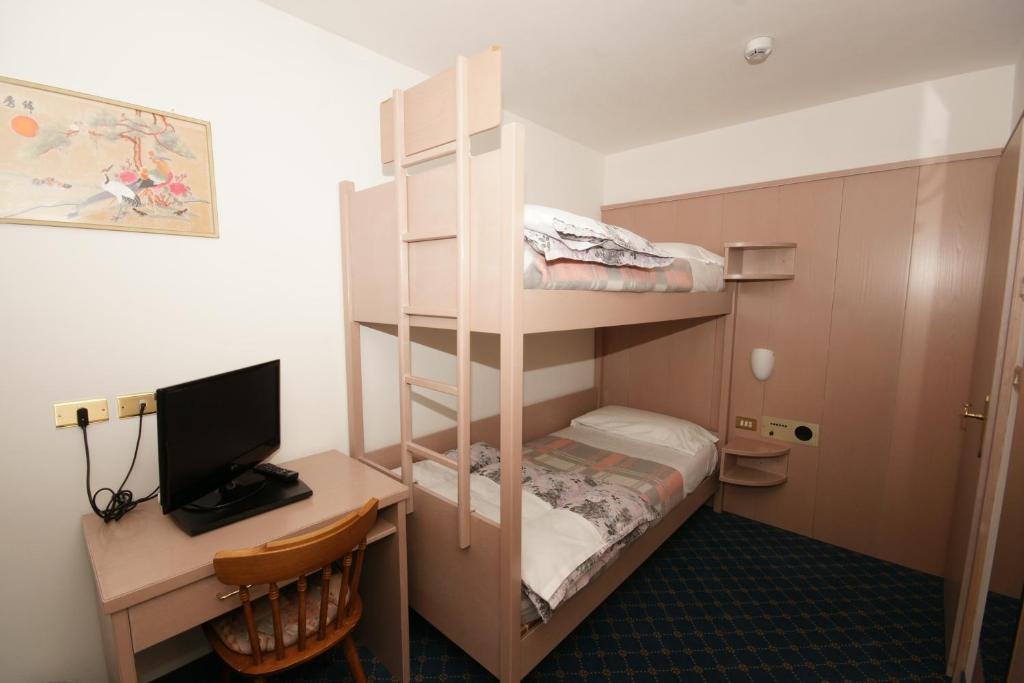 Postel nebo postele na pokoji v ubytování Hotel Villa Mozart