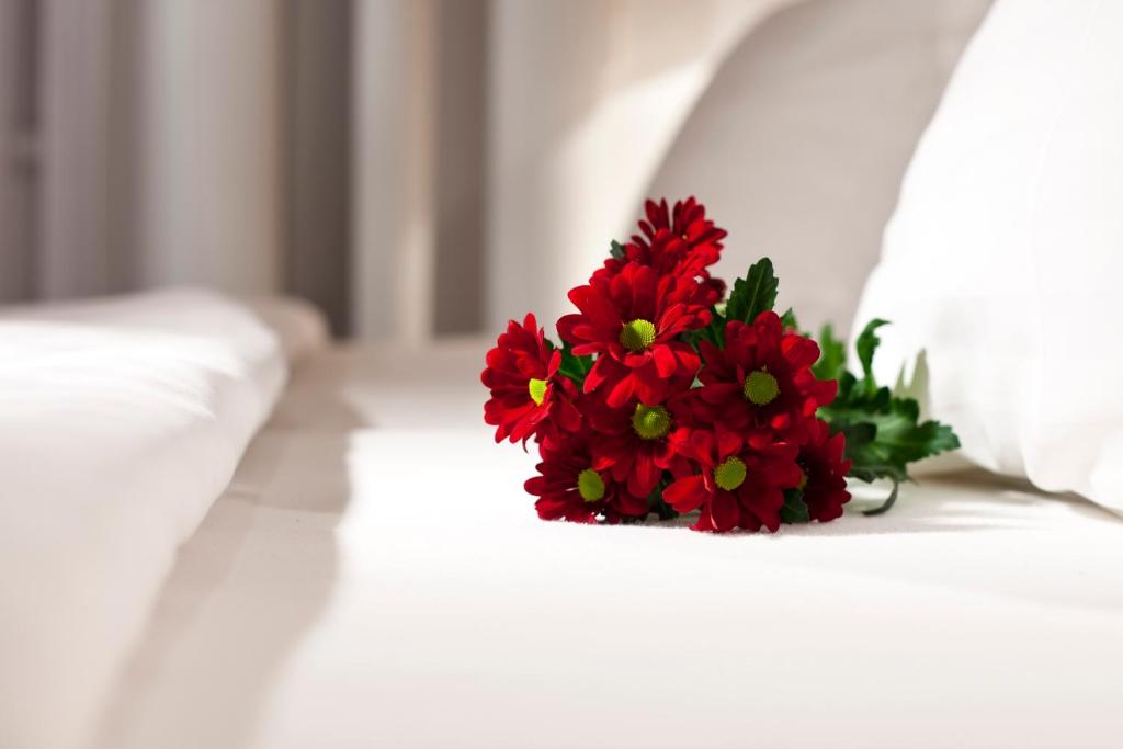 Postel nebo postele na pokoji v ubytování Dahlia Inn