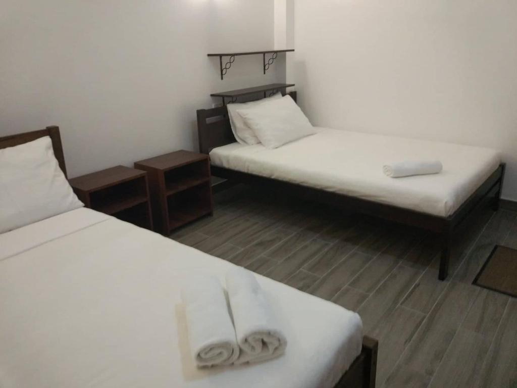 Postel nebo postele na pokoji v ubytování CASA MIA INN
