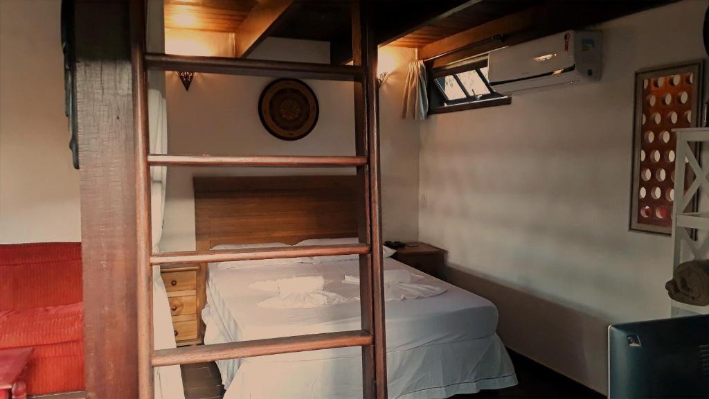 Postel nebo postele na pokoji v ubytování Chalés da Longa