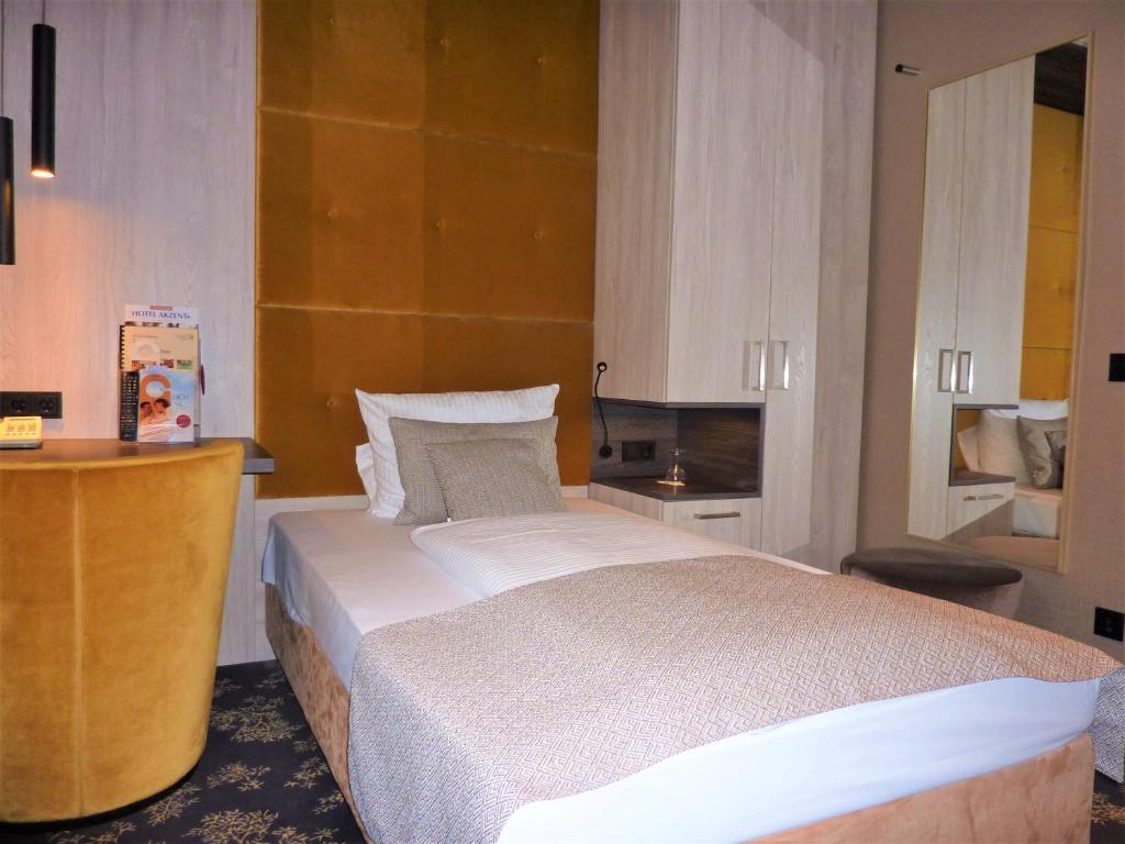 Postel nebo postele na pokoji v ubytování Akzent Waldhotel Rheingau