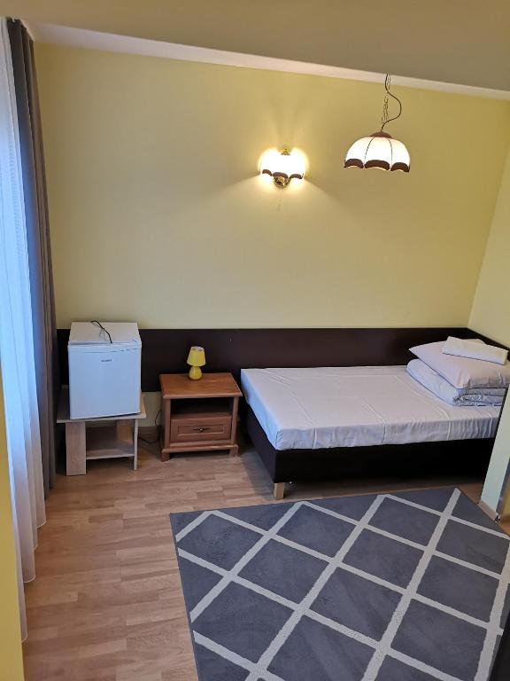 Postel nebo postele na pokoji v ubytování Hotel Duka