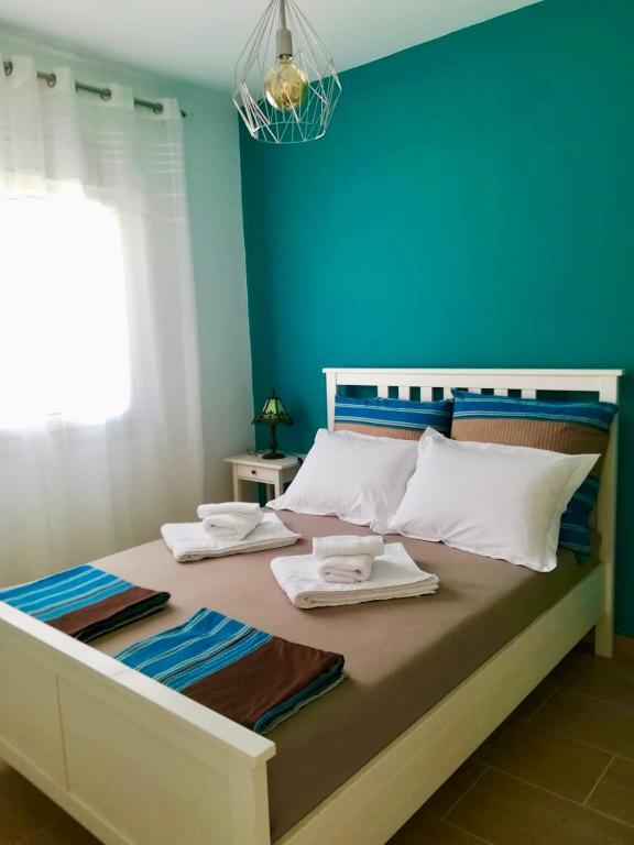 Posteľ alebo postele v izbe v ubytovaní Villa Dimitri - Beach House
