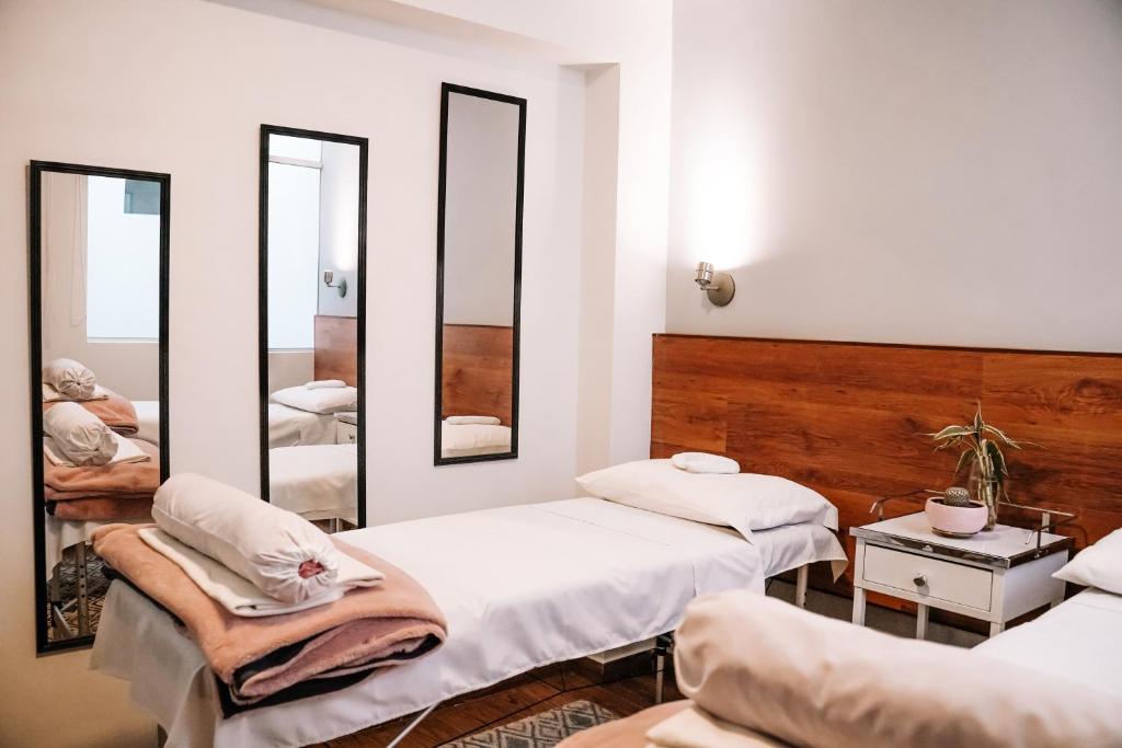 Ένα ή περισσότερα κρεβάτια σε δωμάτιο στο Muru Homely Hotel Cusco