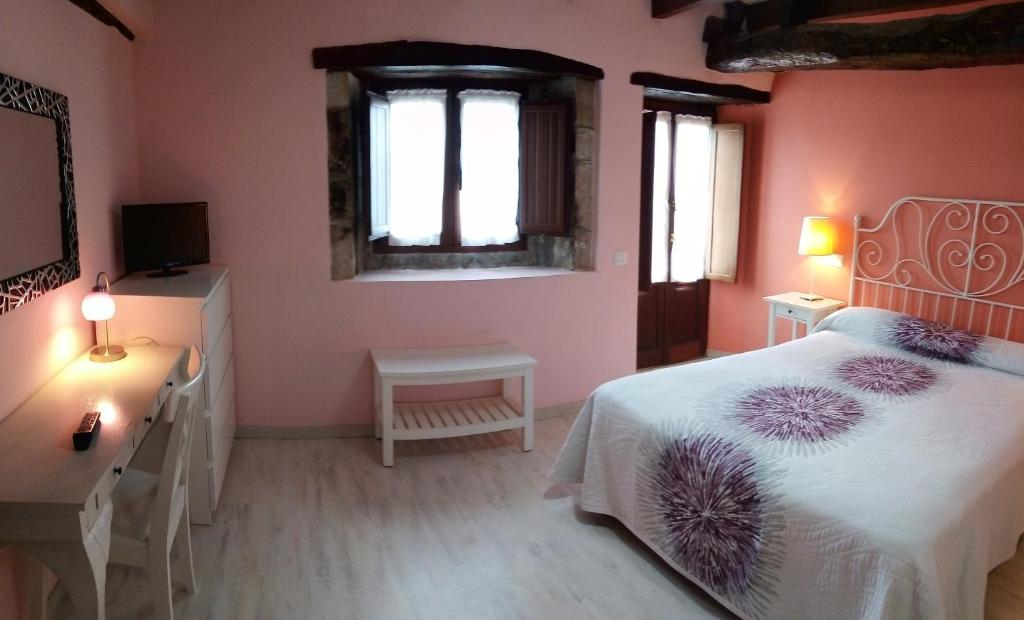 Postel nebo postele na pokoji v ubytování Apartamentos El Majuelo