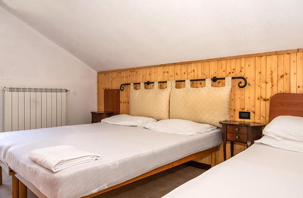 Letto o letti in una camera di Hostel - Bormio - Livigno - Santa Caterina - Stelvio