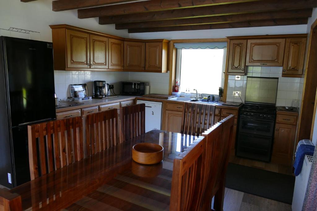 Kuchyň nebo kuchyňský kout v ubytování Wallace Lodge