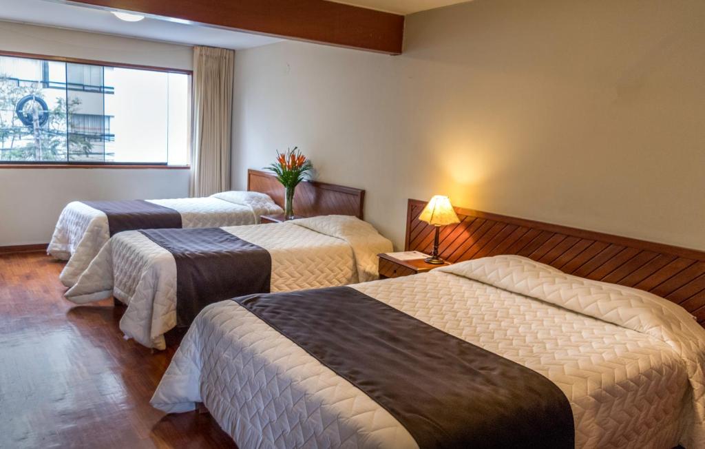 Postel nebo postele na pokoji v ubytování Hotel Señorial