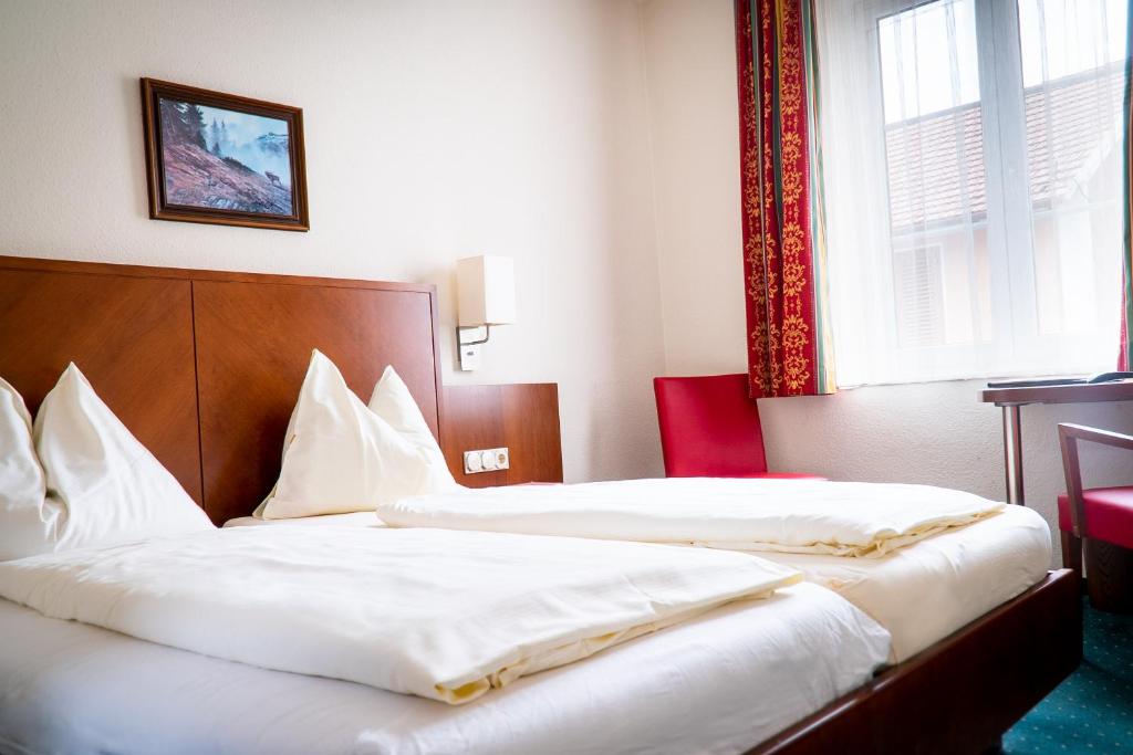 Postel nebo postele na pokoji v ubytování Hotel Krug