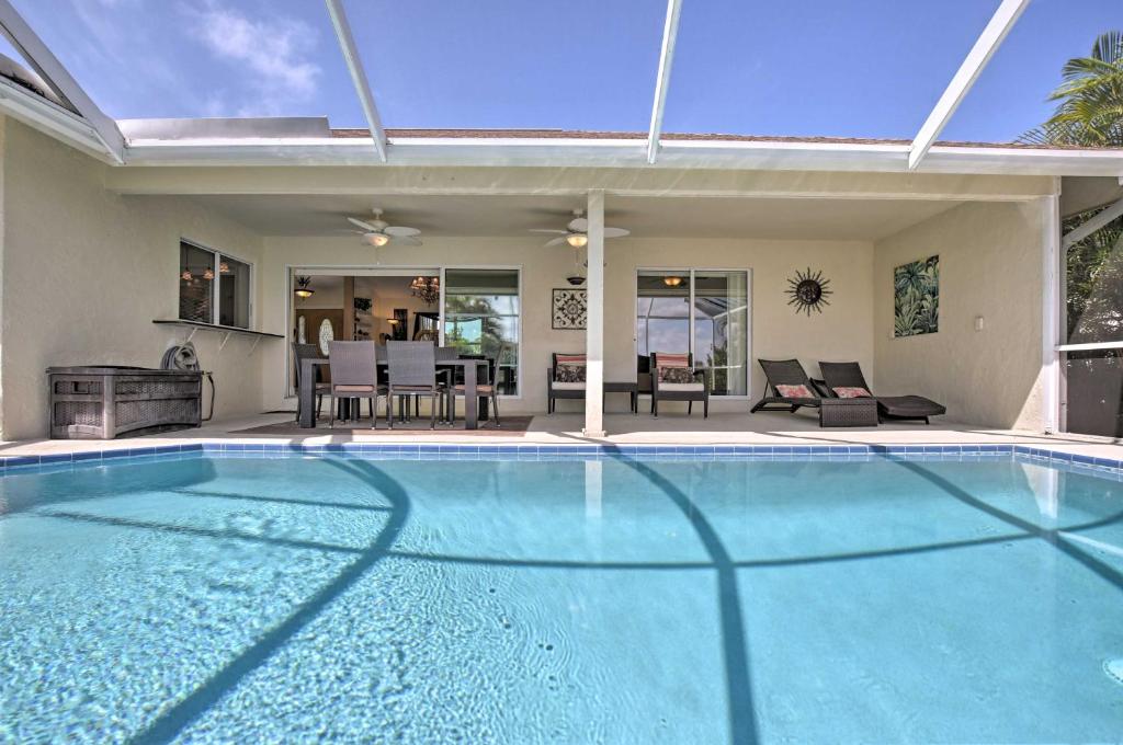 a large swimming pool in a house at Canalfront Home with Private Saltwater Pool and Dock! in Marco Island