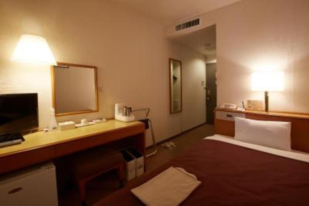 Ένα ή περισσότερα κρεβάτια σε δωμάτιο στο Country Hotel Takayama - Vacation STAY 67704