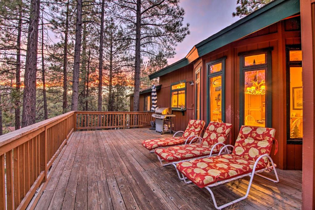 a deck with two chairs and a house at Year-Round Big Bear Mtn Lodge - Hike, Ski, Fish! in Big Bear Lake
