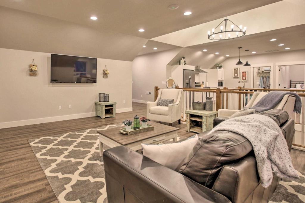 a living room with a couch and a tv at Chic Farmhouse with Creek in Heart of Wine Country! in McMinnville
