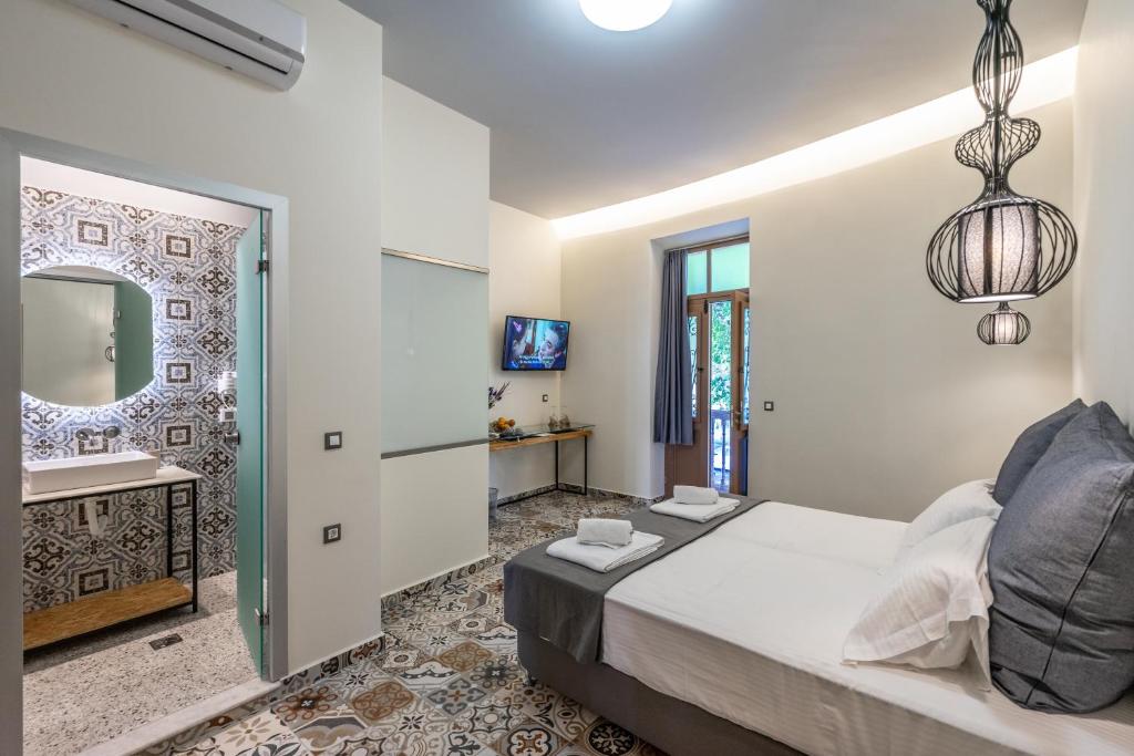 Postel nebo postele na pokoji v ubytování Casa Poli Suites