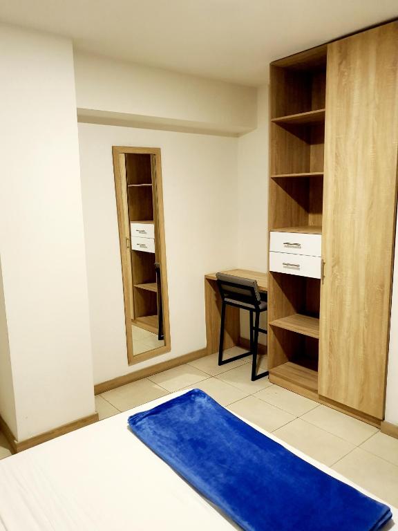 Postel nebo postele na pokoji v ubytování HOTEL MEDELLIN CENTRAL