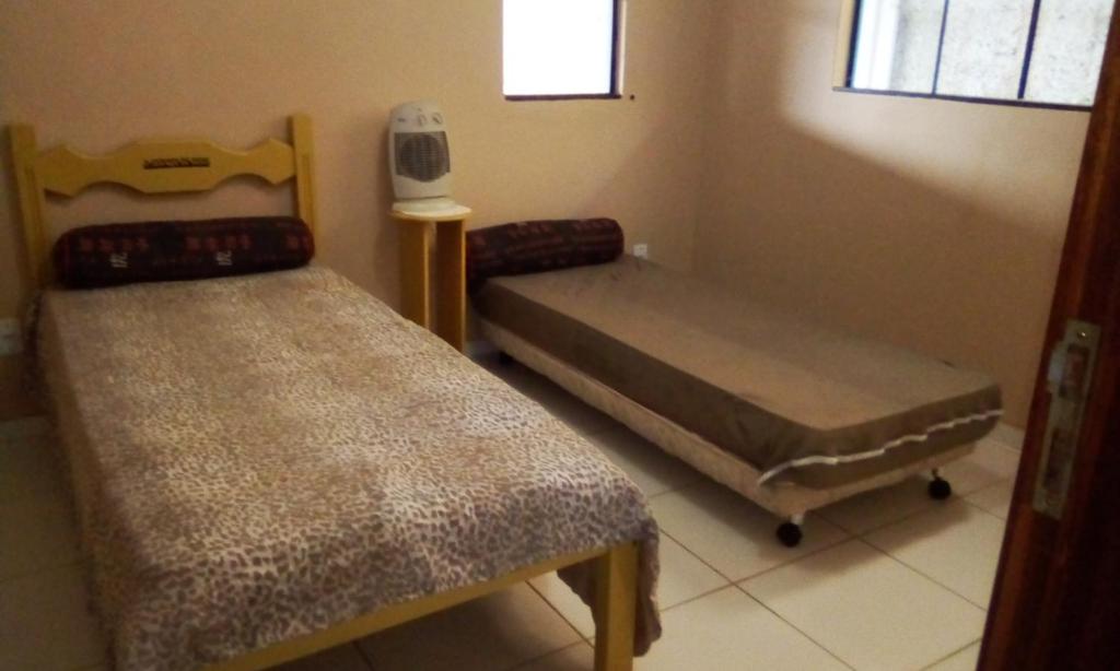  suite em casa de familia