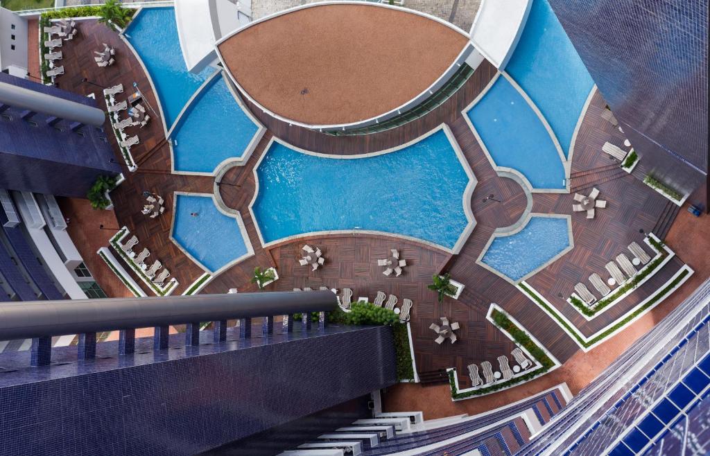 an overhead view of a building with a pool at Beach Class Exclusive in Fortaleza