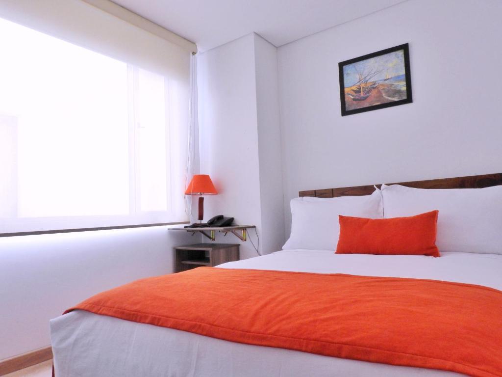 Postel nebo postele na pokoji v ubytování Hotel Portal de los Andes
