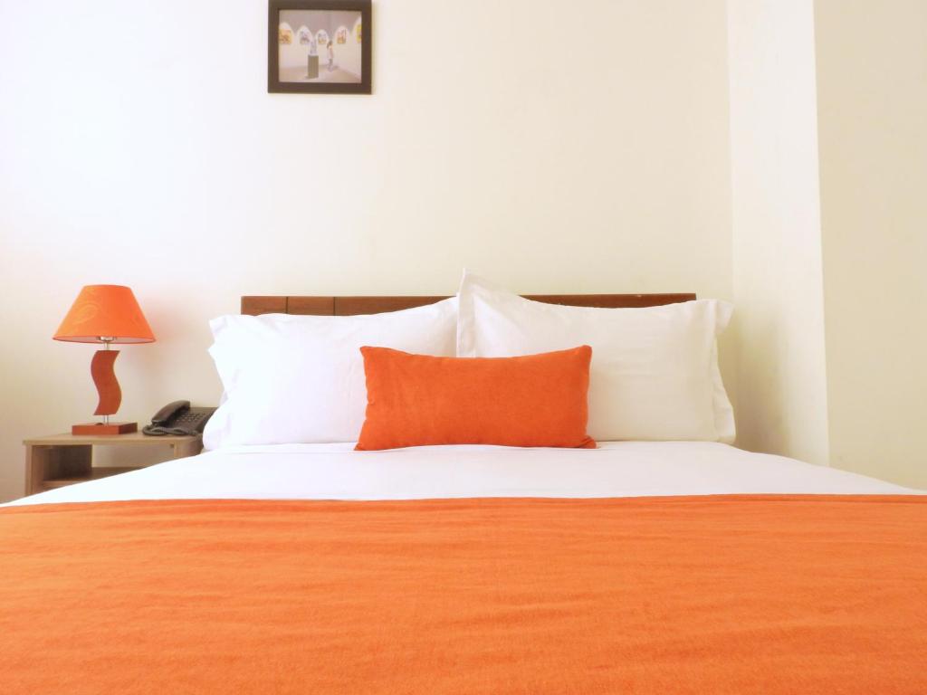 Postel nebo postele na pokoji v ubytování Hotel Portal de los Andes