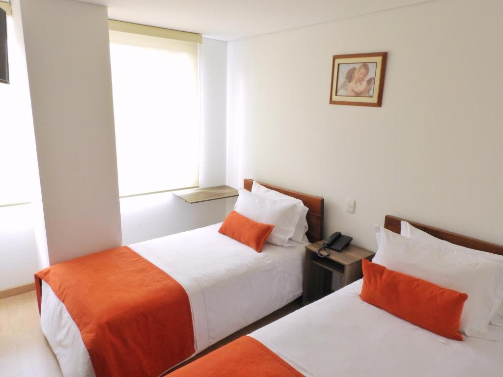 Postel nebo postele na pokoji v ubytování Hotel Portal de los Andes
