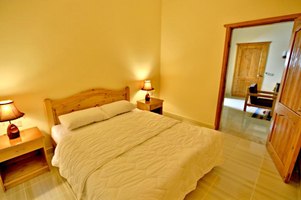 Postel nebo postele na pokoji v ubytování Sheikh Ali Dahab Resort