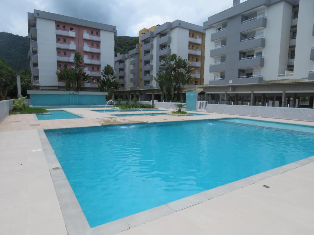  Lindo apartamento novo com piscinas no Pereque Açu Condominio Passaredo