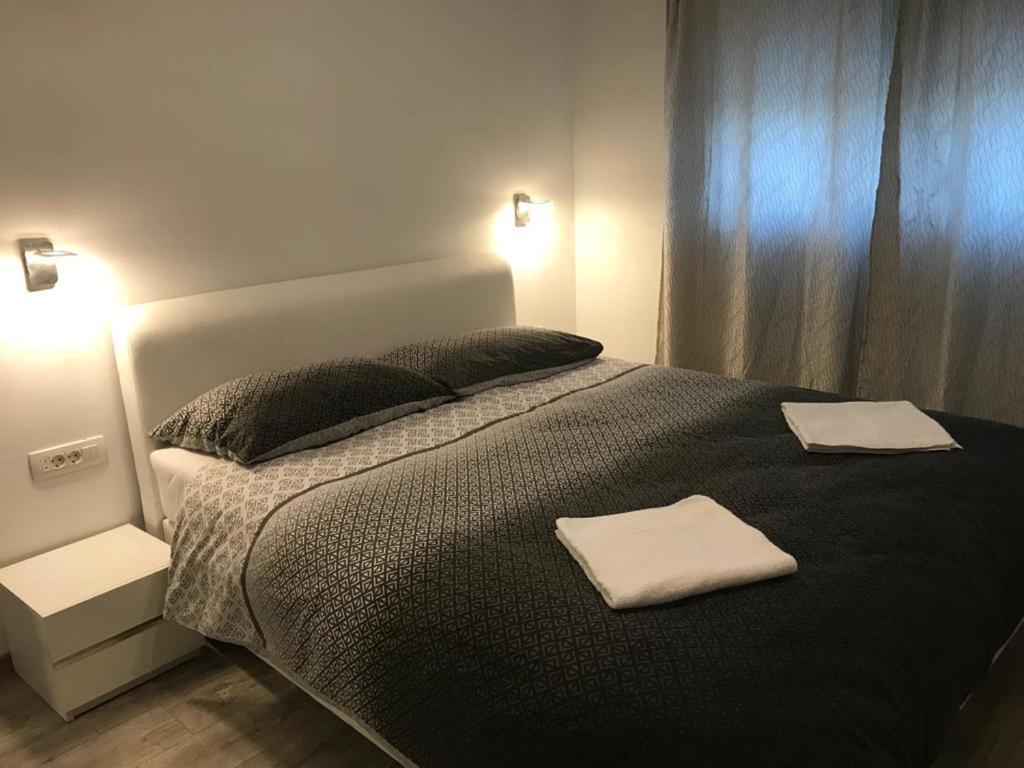 Postel nebo postele na pokoji v ubytování Apartmani Jukic