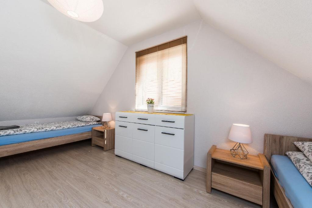 Posteľ alebo postele v izbe v ubytovaní Dom Kaszubski nr 65
