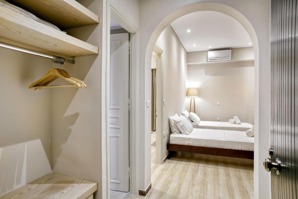 Postel nebo postele na pokoji v ubytování Villa Eftichia Hotel Apartments & Studios