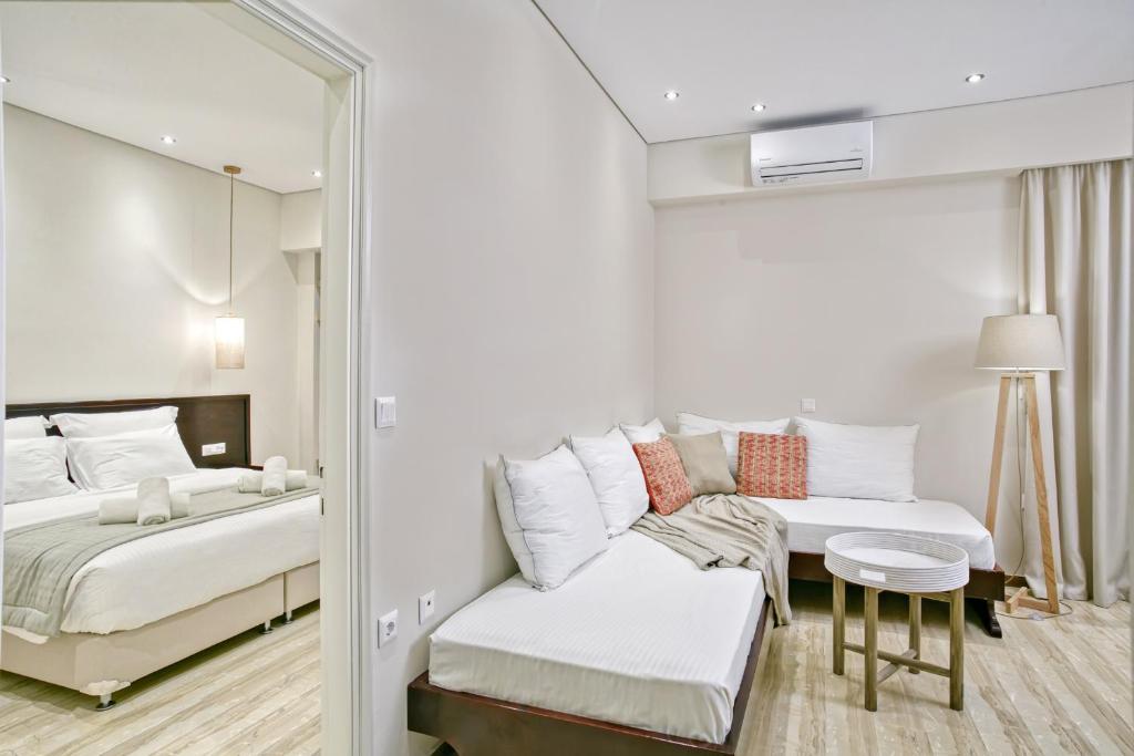 Postel nebo postele na pokoji v ubytování Villa Eftichia Hotel Apartments & Studios