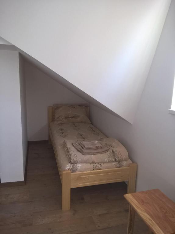 Postel nebo postele na pokoji v ubytování Apartmani Mimi