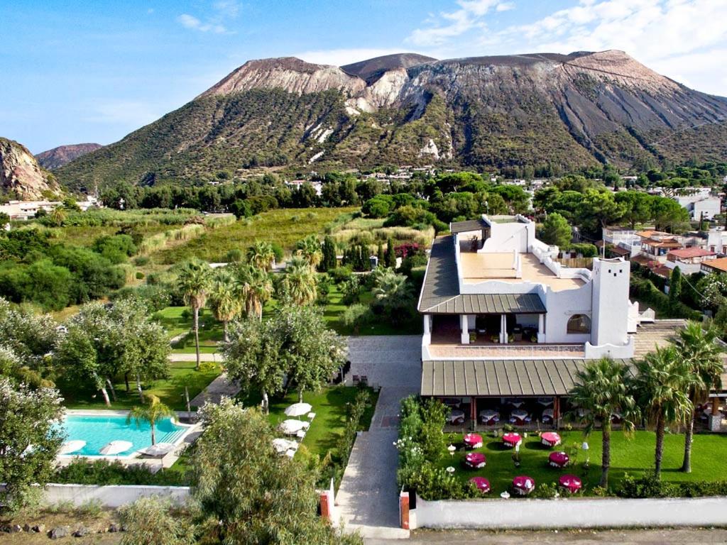 an aerial view of a house with a mountain in the background at Hotel Garden in Vulcano