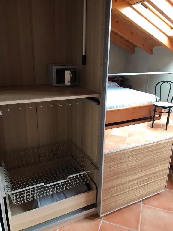 A bed or beds in a room at Mansarda Margherita