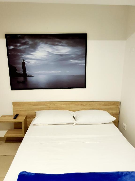 Postel nebo postele na pokoji v ubytování HOTEL MEDELLIN CENTRAL