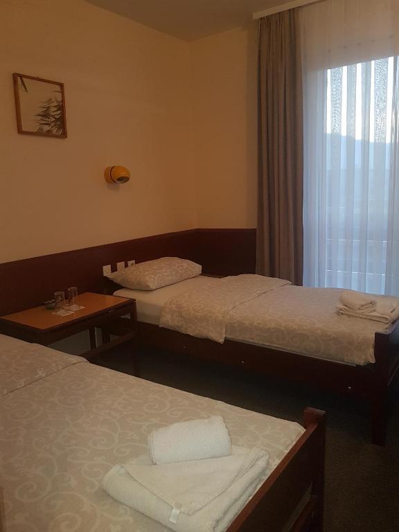 Voodi või voodid majutusasutuse Hotel Sax Balkan toas