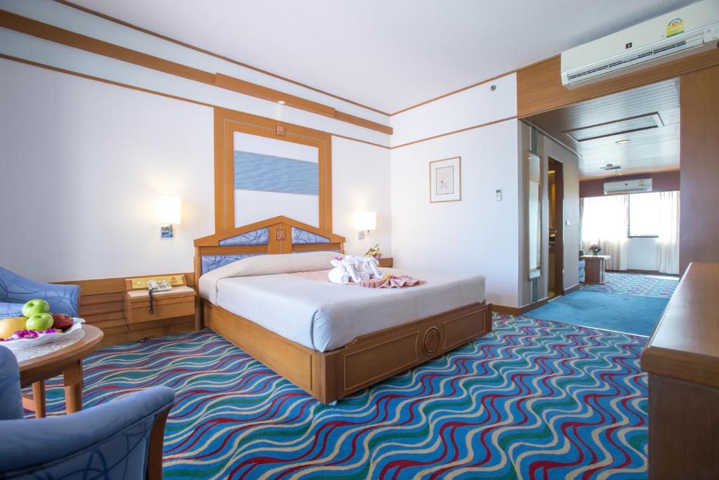Postel nebo postele na pokoji v ubytování Asia Cha-am Hotel