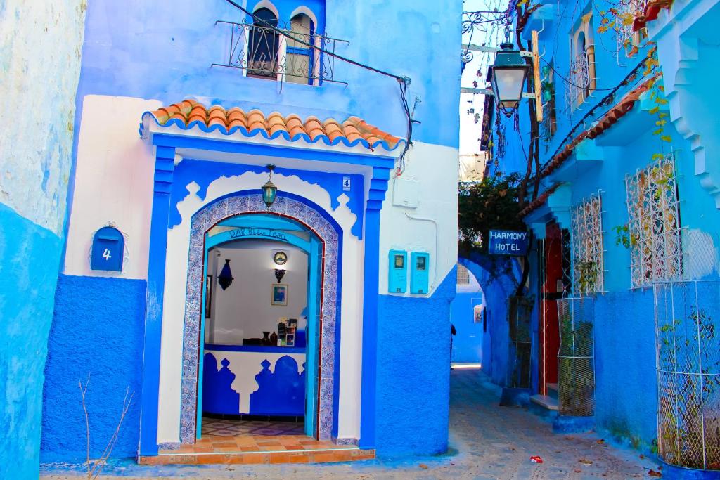 a blue and white building with an archway at Dar Bleu Pearl in Chefchaouene