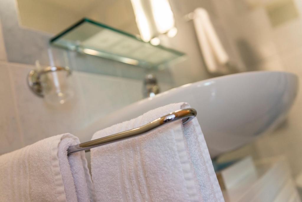 a towel rack in a bathroom with a sink at Residence Treyer in Terento