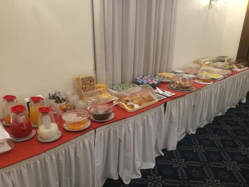 a long table filled with lots of food at Hotel Villa Delle Rose in Rome