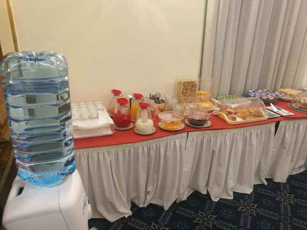 a table full of food on top of a table at Hotel Villa Delle Rose in Rome