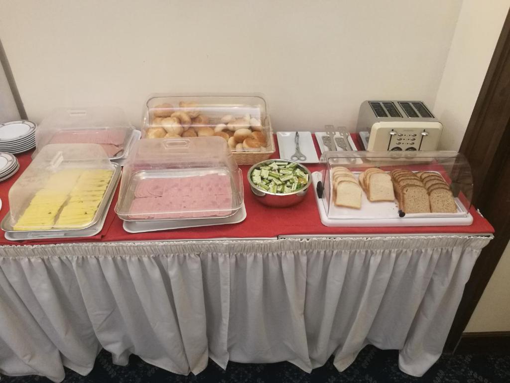 a table with different types of food on it at Hotel Villa Delle Rose in Rome