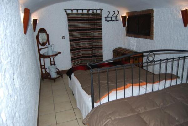 Postel nebo postele na pokoji v ubytování Cueva El Haro