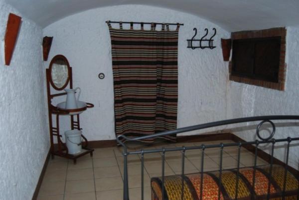 Postel nebo postele na pokoji v ubytování Cueva El Haro