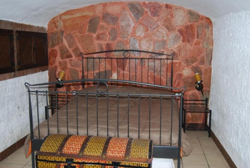 Postel nebo postele na pokoji v ubytování Cueva El Haro