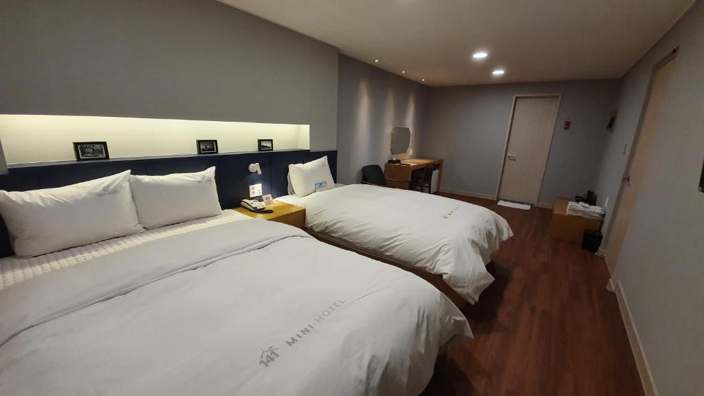 Postel nebo postele na pokoji v ubytování Mini Hotel 141